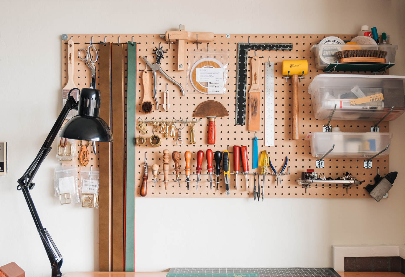 Pegboard with tools and supplies in a workshop setting